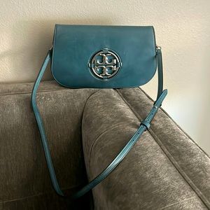 Tory Burch purse with strap and can be used as a clutch.